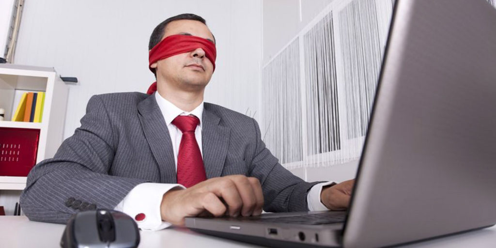 a man with a blindfold symbolizing the need for websites to use ADA compliance
