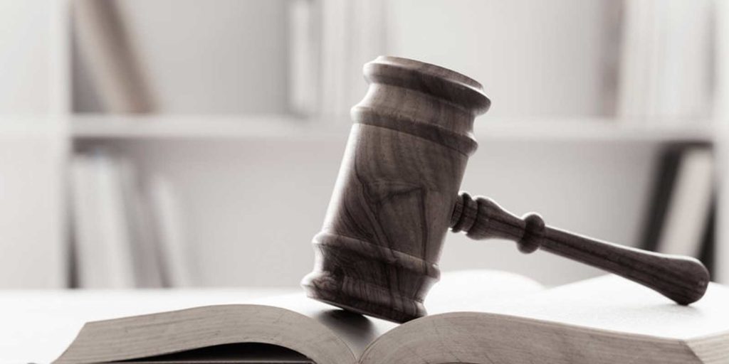 gavel and book symbolizing an attorney who just recently benefitted from a law firm website design overhaul