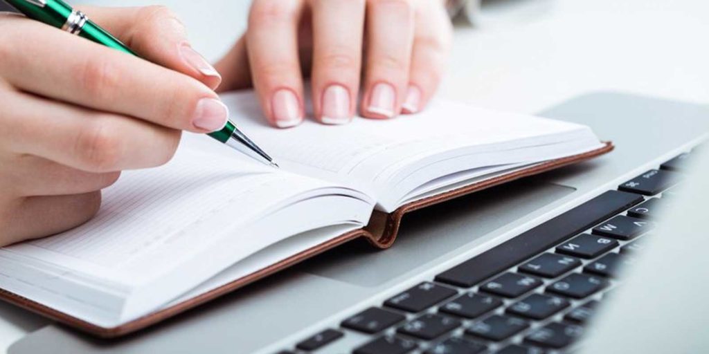 a person writing content in order to employ great inbound marketing strategies and generate new and more business leads than before