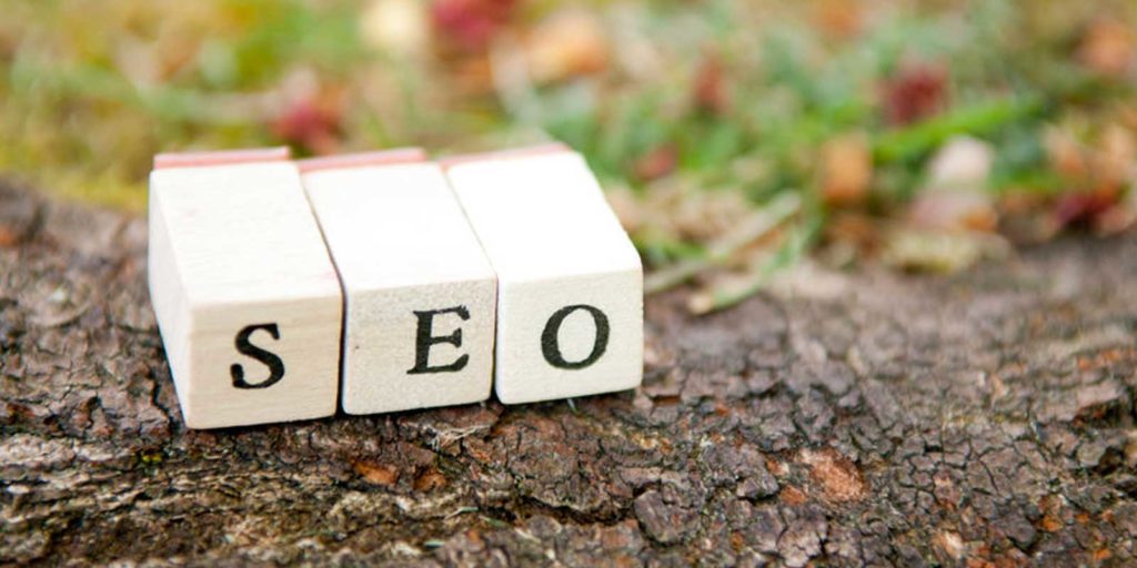 three blocks laying on dirt representing organic SEO which is key to any good dental marketing campaign