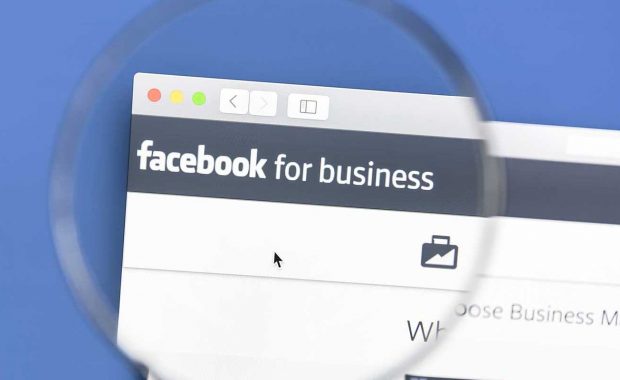 Magnifying glass looking at the Facebook for Businesses page
