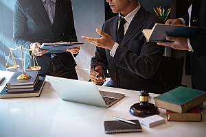 a law firm holding a meeting about potentially acquiring digital marketing services