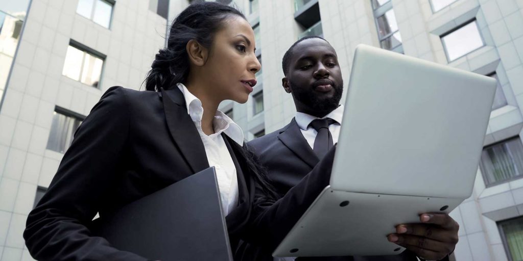 Attorneys looking at important law firm metrics