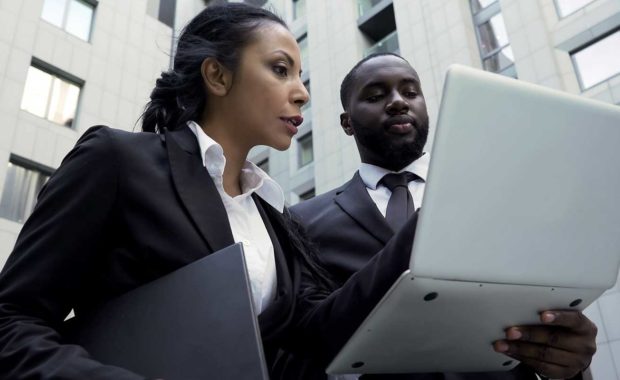 Attorneys looking at important law firm metrics