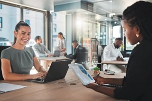portrait of a young digital marketing agency employee writing Fractional Marketing proposal or a growth strategy for the company
