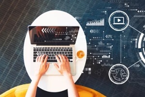 content marketing concept with person using a laptop on a white table