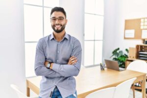 man standing by desk