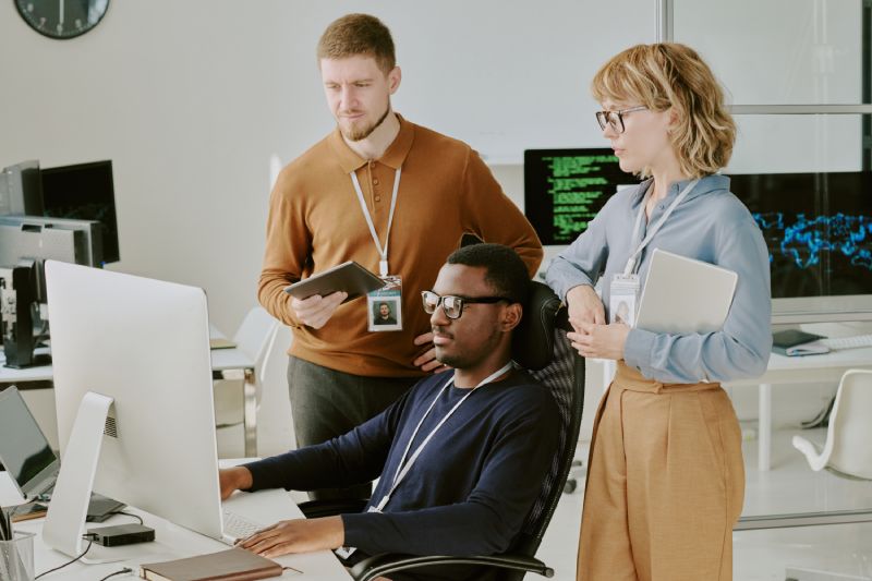 Cyber Specialists Reviewing Metrics For Their Cybersecurity Marketing Campaign