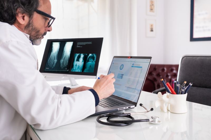Doctor Reviewing His Healthcare Marketing Campaign Data